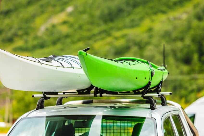 car with two kayaks on roof top
